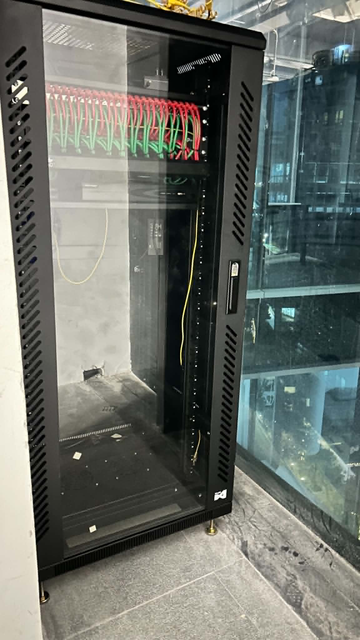 Tall server cabinet prepared for structured equipment installation and network distribution.